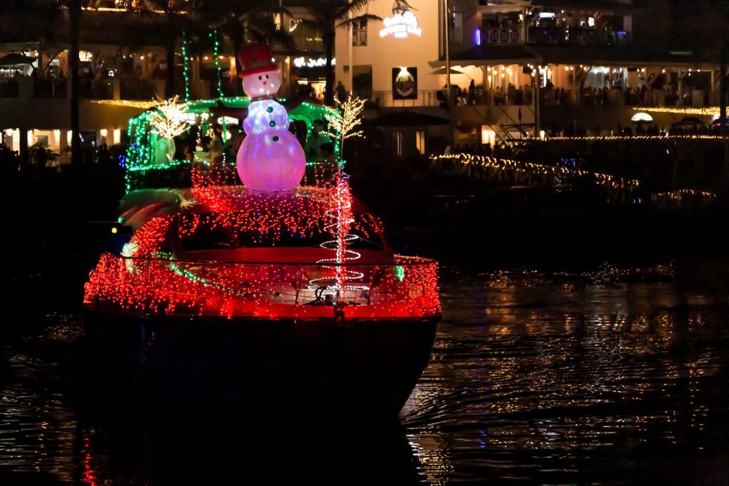 A decorated Christmas boat in a marina in Florida
